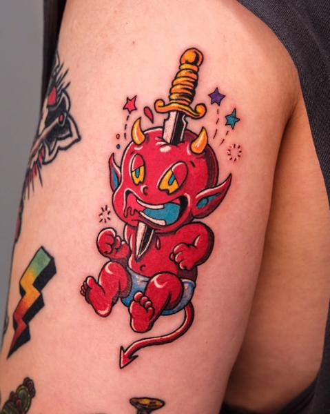 Traditional devil baby tattoo by @melange.tattoo