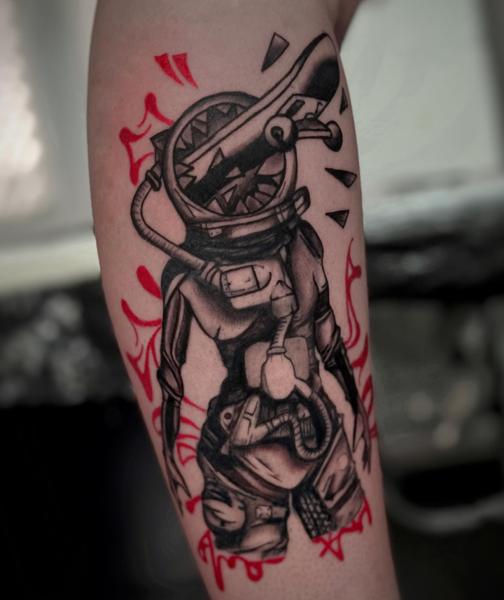 Illustrative astronaut creature tattoo by @melina.tatts