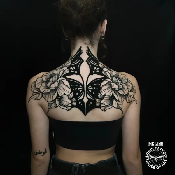 Blackwork floral butterfly tattoo by @melina.tatts