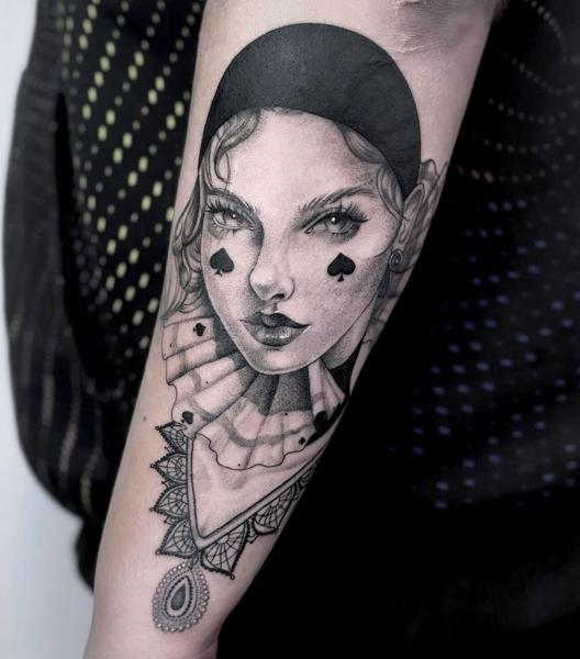 Realism harlequin woman tattoo by @mia.ink._