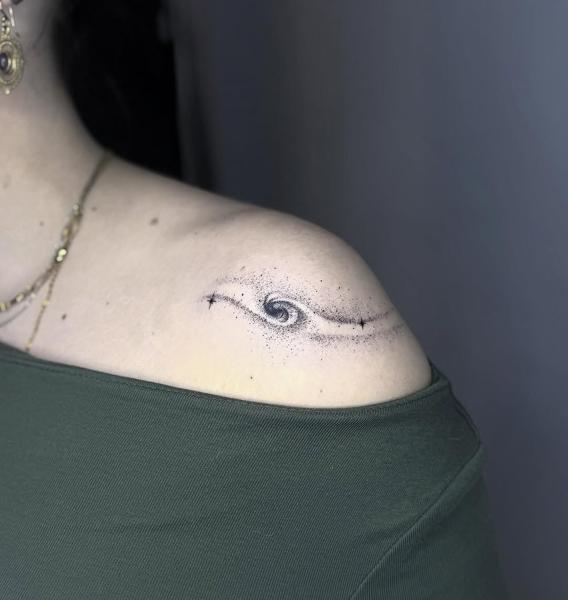 Fine line galaxy swirl tattoo by @mia.ink._