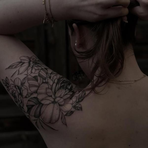 Fine line floral arrangement tattoo by @mia.ink._