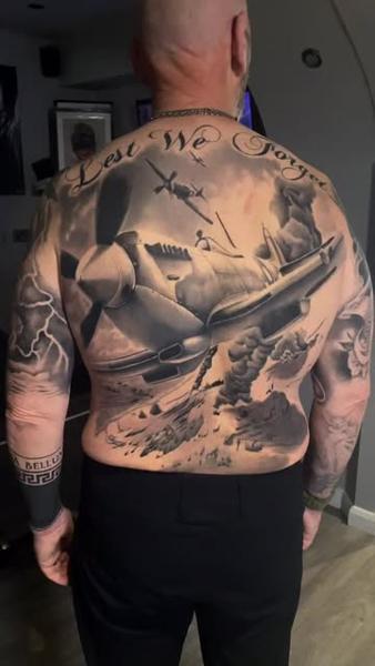 Realism warplane battle tattoo by @michal_zak_tattoo