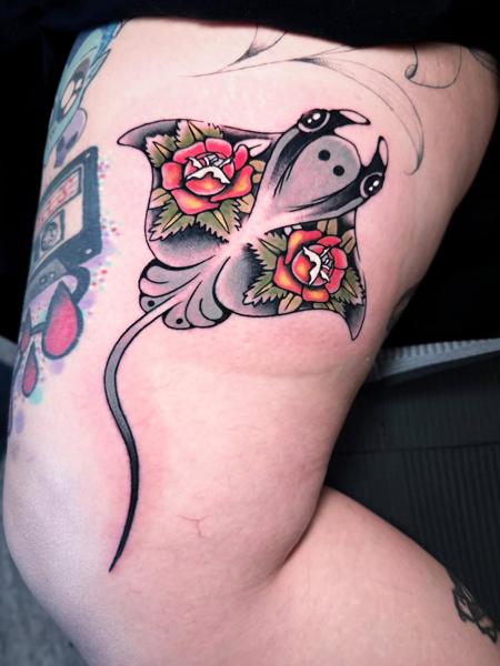 Traditional stingray with flowers tattoo by @miguel.tattooer