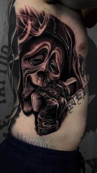 Realism hooded figure tattoo by @miketattoo1320