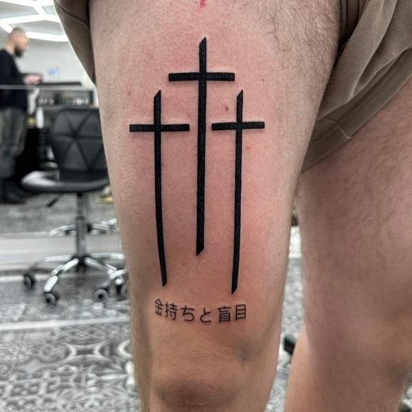 Blackwork crosses with text tattoo by @mikotattoo
