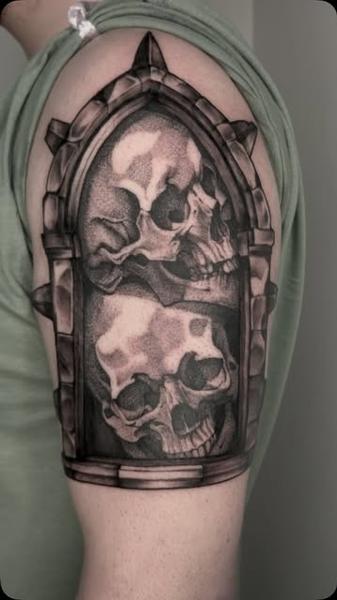 Realism skulls in frame tattoo by @mitchmicallef