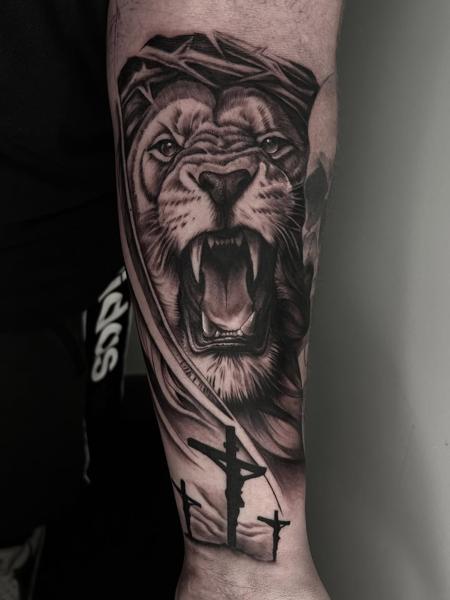Realism lion and cross tattoo by @mitchmicallef