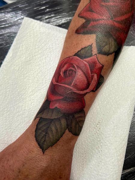 Realism red rose tattoo by @mitchmicallef