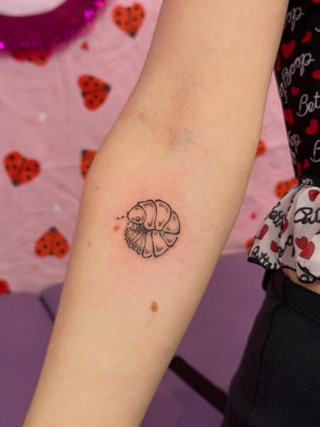 Fine line pill bug tattoo by @moz.tattoos
