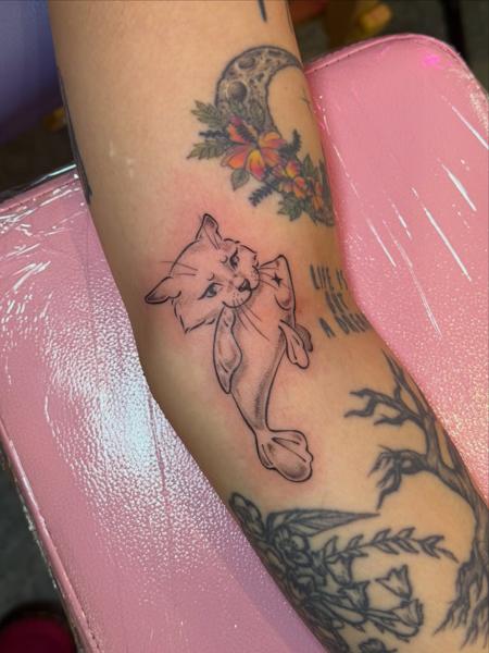 Fine line catfish tattoo by @moz.tattoos