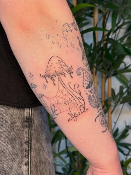 Fine line mushroom and web tattoo by @moz.tattoos