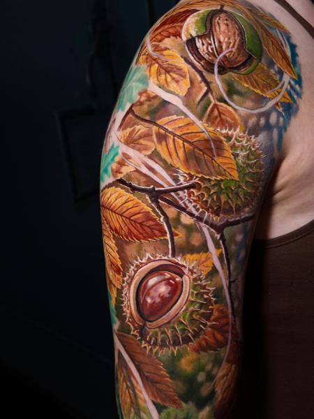 Realism chestnut leaves tattoo by @moriel.seror