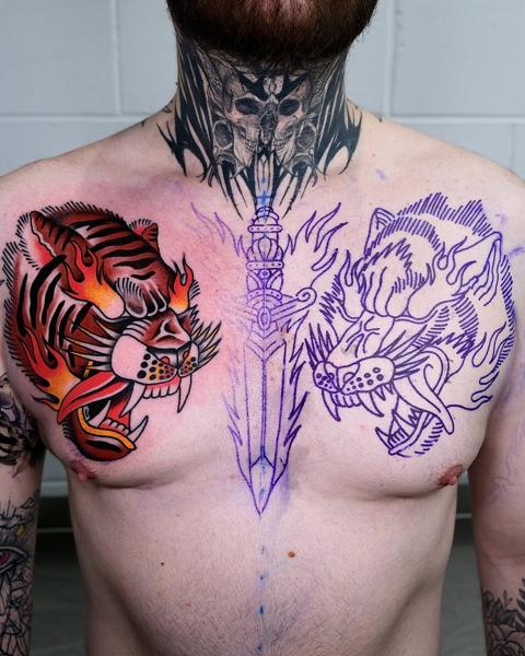 Traditional tiger and sword tattoo by @morstattoo