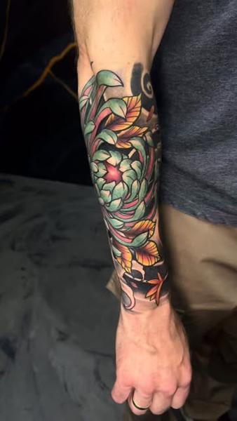 Japanese traditional floral chrysanthemum tattoo by @mortenstubbe_tattoos
