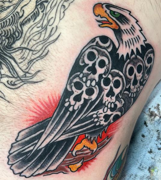 Traditional eagle with skulls tattoo by @mr_wrath