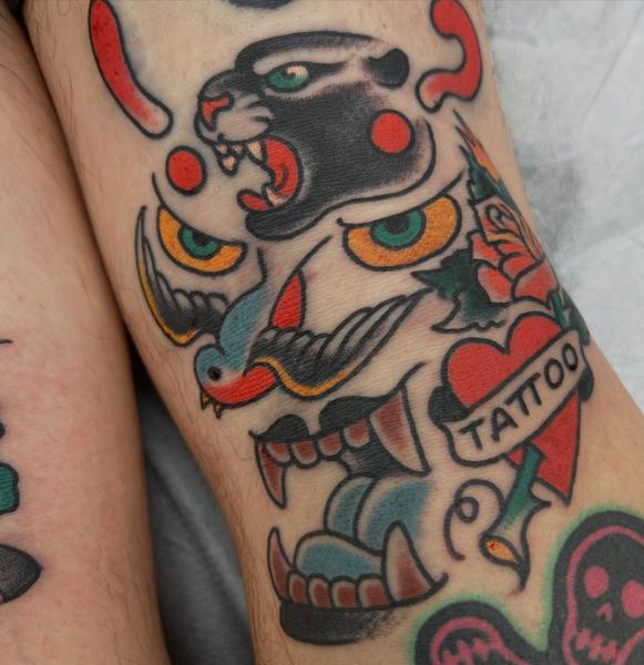 Traditional panther and heart tattoo by @mr_wrath