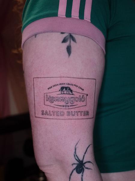 Linework butter logo tattoo by @myb_ink