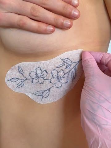 Fine line floral branch tattoo by @myb_ink