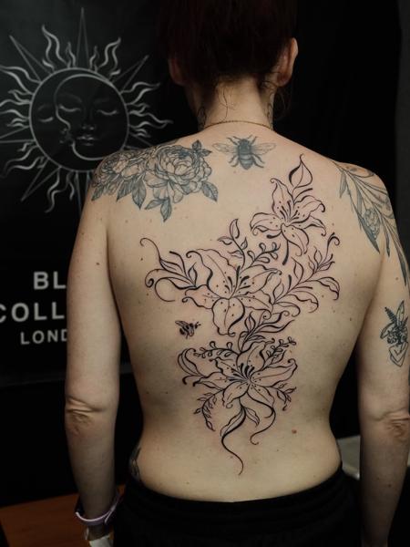 Fine line floral lilies tattoo by @myb_ink