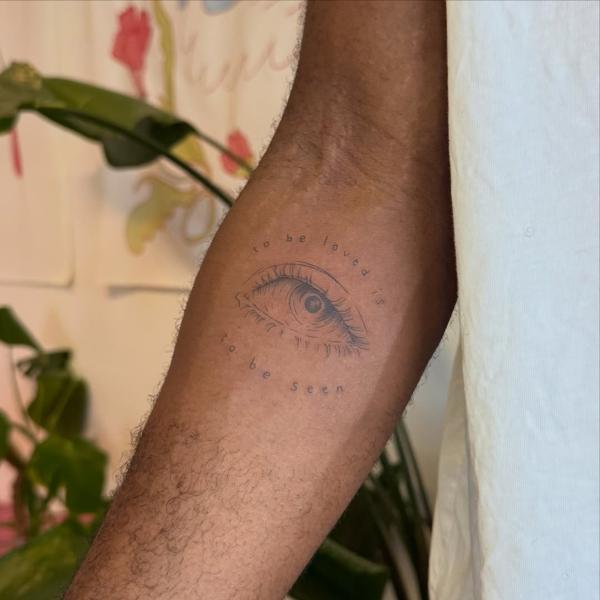 Fine line eye with text tattoo by @myb_ink