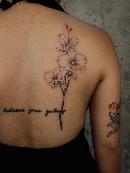 Fine line orchid flower tattoo by @myb_ink