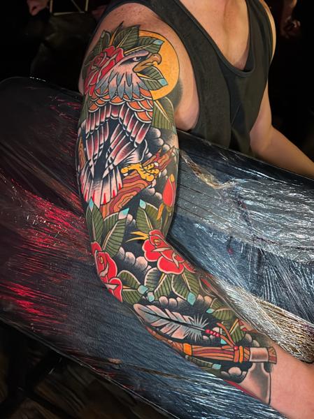 Traditional eagle and flowers tattoo by @mykechambers