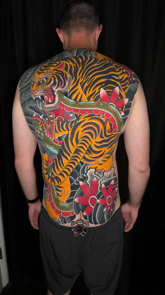 Japanese tiger and snake tattoo by @mykechambers