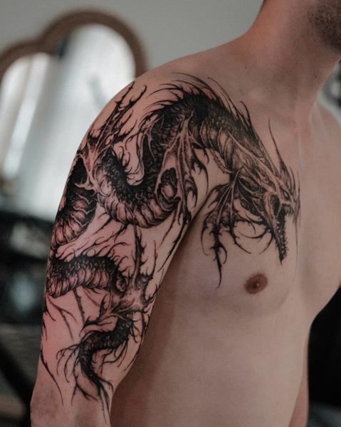Blackwork dragon tattoo by @narak.tat