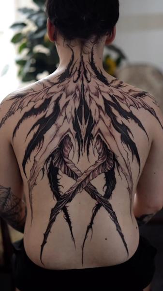 Blackwork abstract wings tattoo by @narak.tat