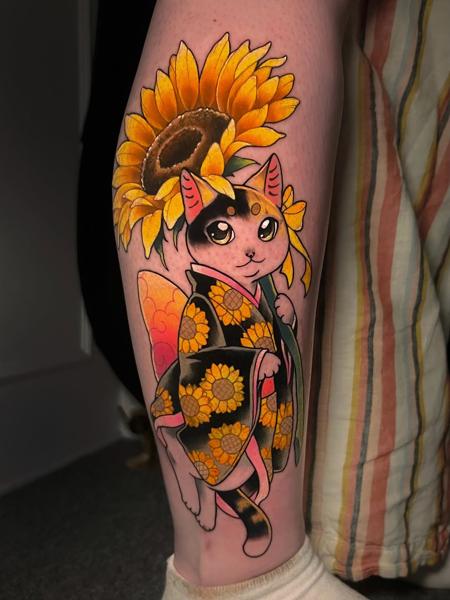 Anime cat with sunflower tattoo by @naaat.j