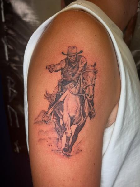 Realism cowboy on horse tattoo by @necro_comicon