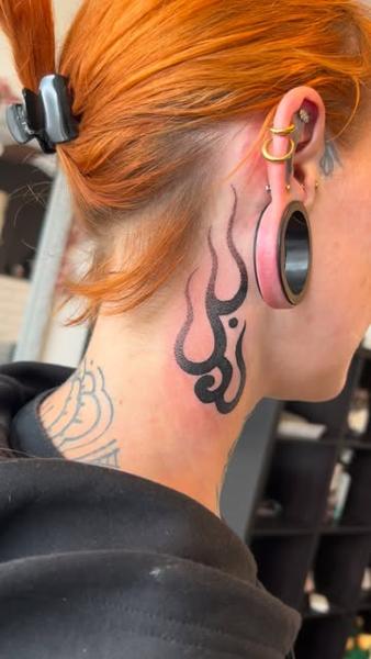 Blackwork flame design tattoo by @niallbarton