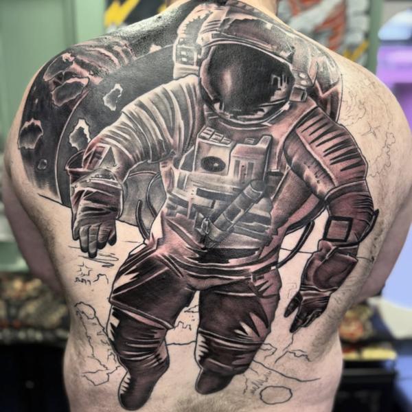 Realism astronaut tattoo by @nickfarbeyond