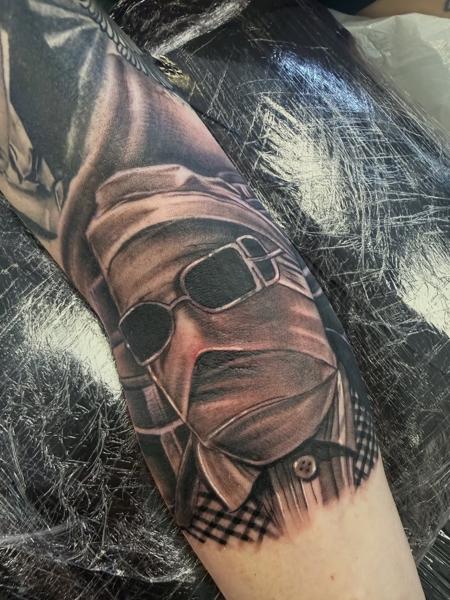 Realism bandaged figure tattoo by @nickfarbeyond