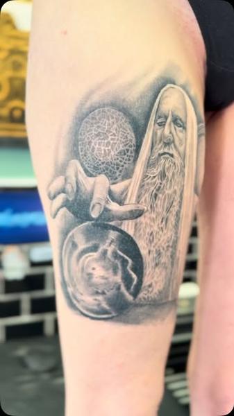 Realism wizard with orbs tattoo by @nickfarbeyond