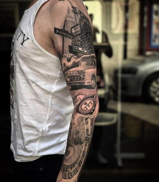 Realism cityscape sleeve tattoo by @nickfarbeyond
