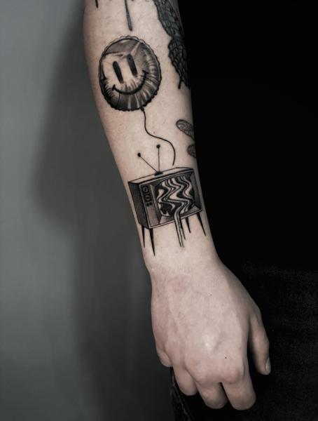 Blackwork tv and balloon tattoo by @nick_theocharis