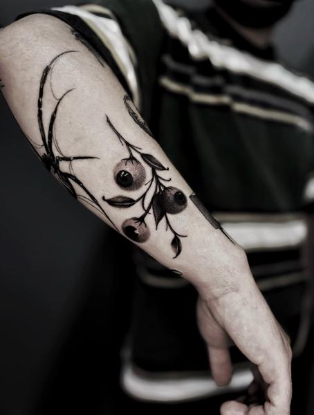 Blackwork branch with berries tattoo by @nick_theocharis
