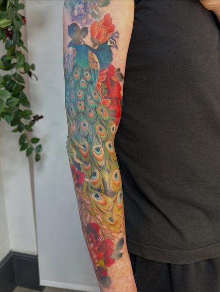 Realism peacock tattoo by @nikole_lowe