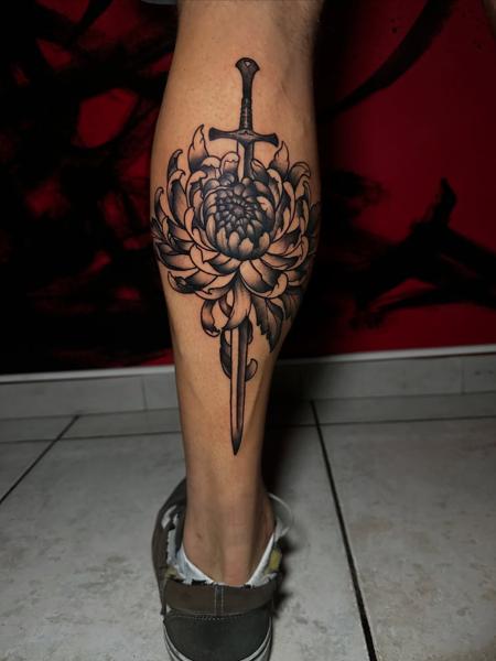 Blackwork sword chrysanthemum tattoo by @mrduke__inkaholic
