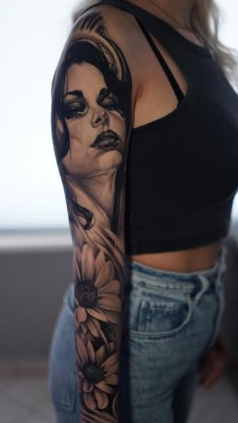 Realism woman portrait tattoo by @nikoselmaidis_tattoo