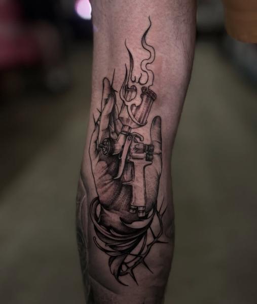 Realism hand with tattoo machine tattoo by @nikoselmaidis_tattoo