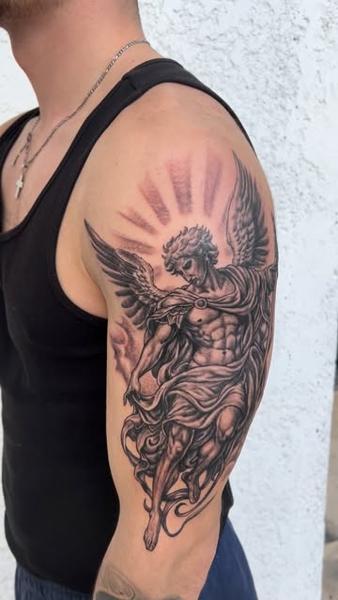 Realism angelic figure tattoo by @nikosrodis