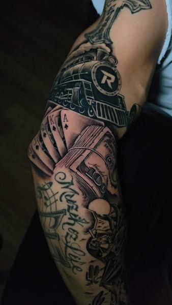 Realism train and cards tattoo by @nmrebel