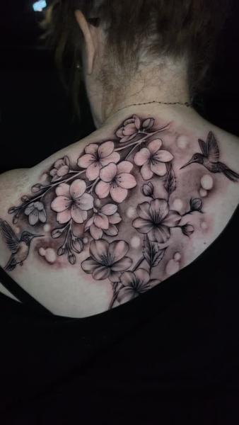 Realism floral hummingbird tattoo by @nmrebel