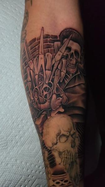 Realism skull and scissors tattoo by @nmrebel