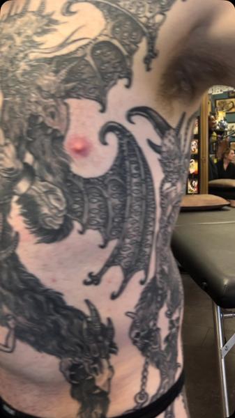 Blackwork dragon tattoo by @noble1tattooing
