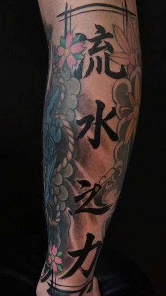 Japanese floral calligraphy tattoo by @oleg_narvski