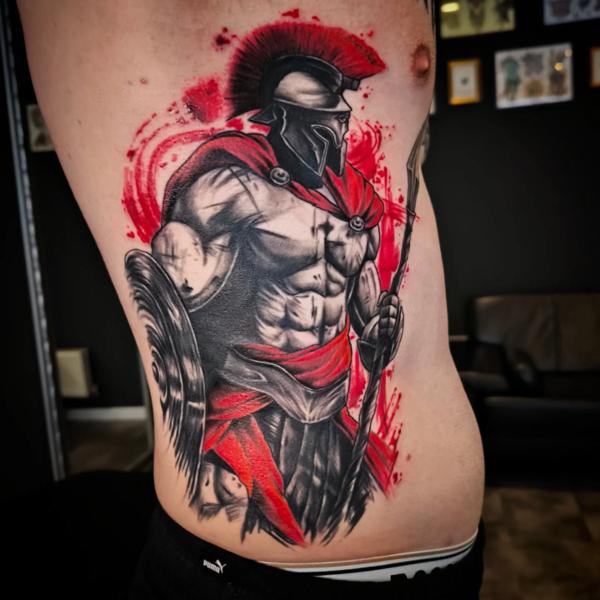 Realism spartan warrior tattoo by @outcast.tattoo.budapest